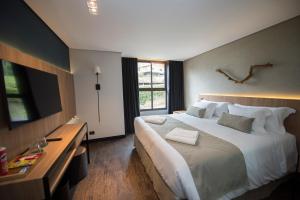 Postel nebo postele na pokoji v ubytování Pinot Hotel
