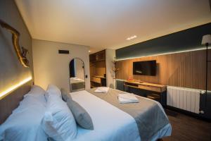 Postel nebo postele na pokoji v ubytování Pinot Hotel