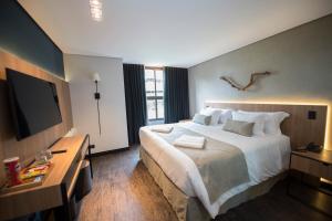 Postel nebo postele na pokoji v ubytování Pinot Hotel