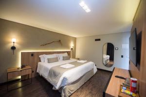 Postel nebo postele na pokoji v ubytování Pinot Hotel