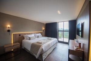 Postel nebo postele na pokoji v ubytování Pinot Hotel