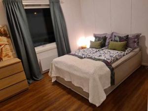 Una cama o camas en una habitación de Fjellveien 4