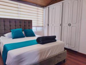Tempat tidur dalam kamar di Hotel Batan 127