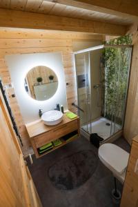 a small bathroom with a sink and a shower at Taunus Tinyhouse in Weilrod