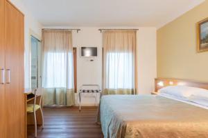 Postel nebo postele na pokoji v ubytování Agriturismo Colombera