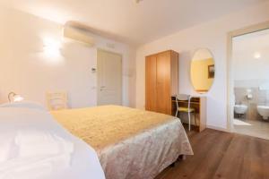 Postel nebo postele na pokoji v ubytování Agriturismo Colombera