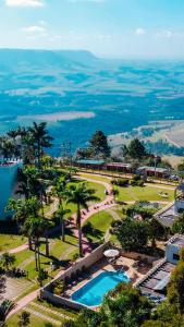 an aerial view of a resort with a swimming pool at SR Boutique Hotel in São Pedro