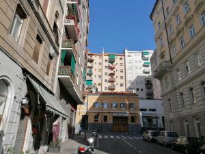 a view of a city street with tall buildings at Tana Bianca in Trieste