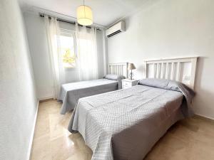 A bed or beds in a room at Reserva del Parque