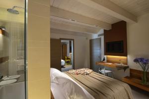 Кровать или кровати в номере Resort Il Gallo Senone