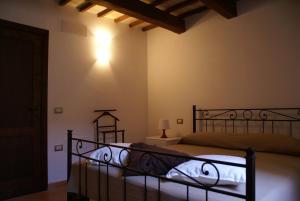 Casa La piccola Macina Ripatransone tesisinde bir odada yatak veya yataklar