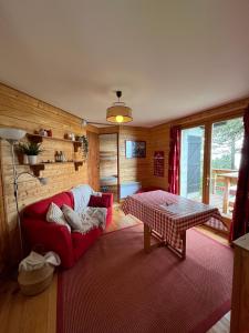 Postelja oz. postelje v sobi nastanitve Chalet des Myrtilles - chalet cosy avec vue