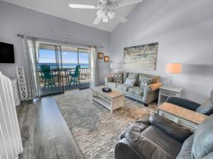 a living room with a couch and a table at Laguna Lookout in Panama City Beach