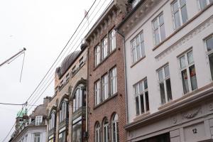 a row of tall buildings on a city street at Latin Quarter by Daniel&Jacob's in Copenhagen