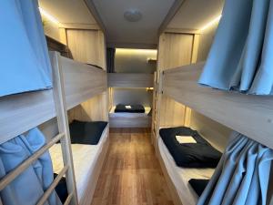 Voodi või voodid majutusasutuse Bad Stuben Hostel toas