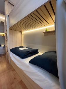 a bedroom with two bunk beds in a room at Bad Stuben Hostel in Turčianske Teplice