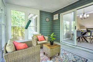 a screened in porch with a couch and a table at Beautiful Raleigh Home with King Bed 3 bedrooms in Raleigh