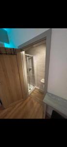 an empty room with a shower and a door at Luxury en-suite for single professional in Manchester
