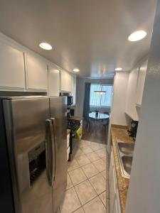 a kitchen with a large stainless steel refrigerator at Beverly Hills City Vibe 1 br Apt w Parking 324 in Los Angeles