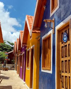 a row of colorful buildings on a street at Pousada Oencontro in Rio de Janeiro