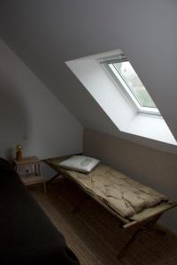 a bed in a room with a window at Maison Saint Georges in Saint-Georges-sur-Cher