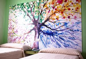 Postel nebo postele na pokoji v ubytování Hotel Sur Utopia