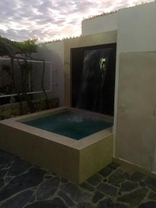 a jacuzzi tub in a building with a window at Casa Bella Salinas in Salinas