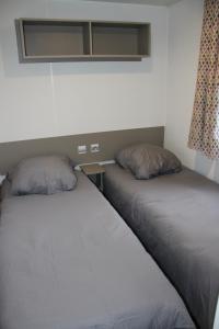 A bed or beds in a room at Mobil-home