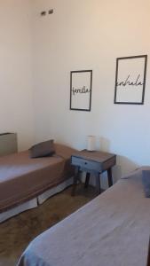 Ένα ή περισσότερα κρεβάτια σε δωμάτιο στο Posada Fresnos Dorados
