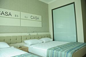 En eller flere senge i et værelse på Orfeus Queen Spa