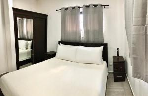 Ein Bett oder Betten in einem Zimmer der Unterkunft Samudra Villas 2