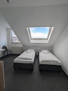 מיטה או מיטות בחדר ב-City Apartment & Lift - Hoeft