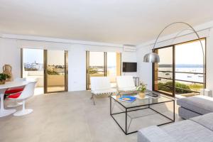 a living room with a couch and a table at La Savina Dream in La Savina
