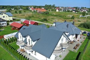 an aerial view of a house with a roof at Balaton Rowy in Rowy