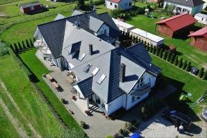 an overhead view of a large house with a roof at Balaton Rowy in Rowy