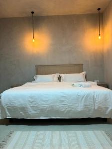 Łóżko lub łóżka w pokoju w obiekcie Palms Lodge