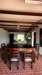 a dining room with a table and chairs at Casa 'Los Colibries' in Salta +18 photos