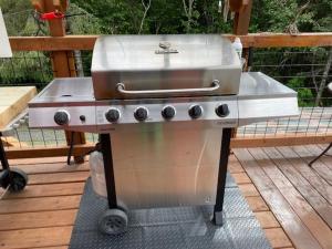 a grill sitting on top of a deck at Resurrection Peaks Lodge in Seward