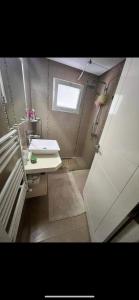 a small bathroom with a sink and a mirror at Villa lucky in Hammamet
