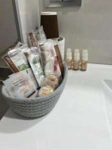 a basket of products sitting on top of a counter at Lupo Luxury Rooms in Bologna