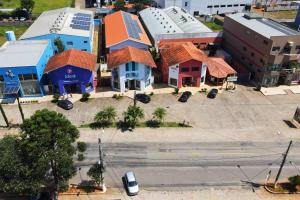 an aerial view of a town with buildings and a street at Apartamento em Borda da Mata in Borda da Mata