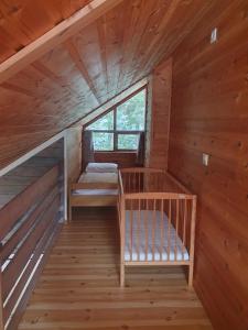 a room with two bunk beds in a cabin at Kvamskogen & Hardanger Holliday homes in Norheimsund