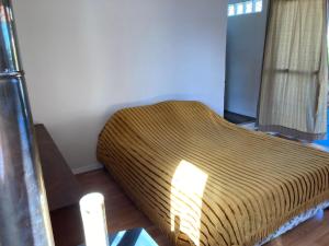 a bedroom with a large bed in a room at La casita in La Esmeralda  +14 photos