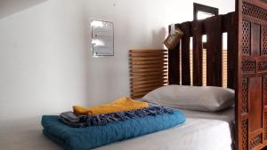 A bed or beds in a room at Corralejo Garden&Relax