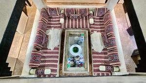 a bathroom with a washing machine in a mirror at Riad Dar Haven in Tamraght Ou Fella