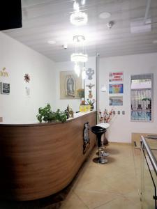 a barber shop with a wooden counter in a room at HOTEL GLASS LAS VEGAS in La Vega +65 photos