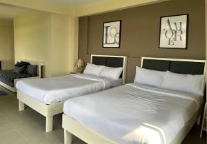 Voodi või voodid majutusasutuse D'ELEMENTS HOTEL AND DORMITORY toas