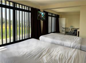 Voodi või voodid majutusasutuse D'ELEMENTS HOTEL AND DORMITORY toas