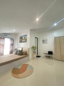 a living room with a bed and a table at The Penthouse Suite in Pusok