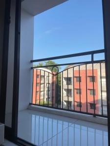 an empty balcony with a view of a building at The Penthouse Suite in Pusok